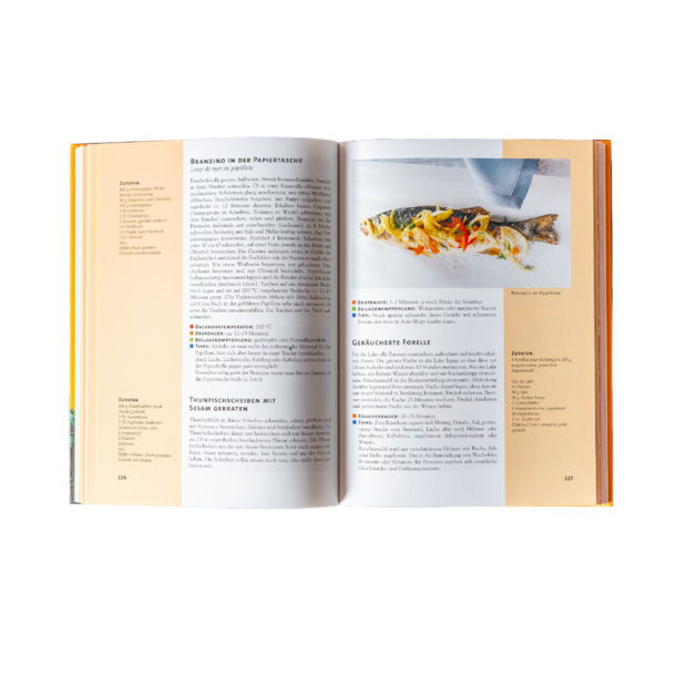 Modern patio with wooden terrace and a black pergola with metal frame attached to a light-colored house.